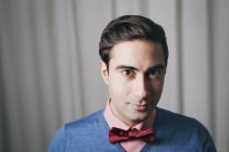 Portrait of man wearing bow tie, focus on foreground — Stock Photo