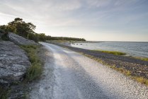 Scenic view of dirty road along beach — Stock Photo