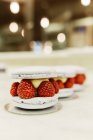 Deserts with berries at bakery, focus on foreground — Stock Photo