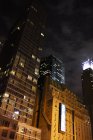 Illuminated skyscrapers at night, new york city — Stock Photo