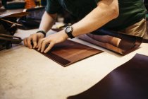 Man measuring leather, selective focus — Stock Photo