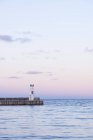Scenic view of lighthouse on groyne at northern europe — Stock Photo