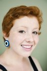Portrait of young redhair woman looking at camera — Stock Photo