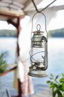 Oil lamp hanging from rope, focus on foreground — Stock Photo