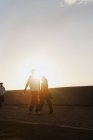 Couple holding hands while walking, selective focus — Stock Photo