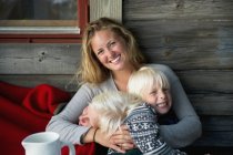 Mother with two sons, selective focus — Stock Photo