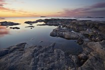 Rocky coastline at sunset, northern europe — Stock Photo