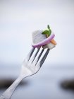 Close- up of traditional swedish pickled herring on fork, selective focus — Stock Photo