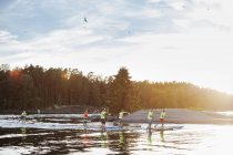 Paddlers by shore during race, selective focus — Stock Photo