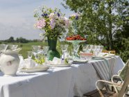 Table prepared for midsummer celebrations, differential focus — Stock Photo