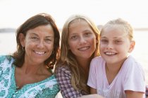 Portrait of mother with daughters, focus on foreground — Stock Photo