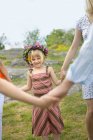 Girl dancing in circle with group of people — Stock Photo