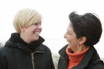 Portrait of two happy women, focus on foreground — Stock Photo