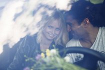Smiling couple in car, selective focus — Stock Photo