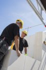 Two workers at construction site, selective focus — Stock Photo