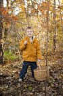 Boy showing chanterelle, selective focus — Stock Photo