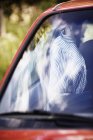 Striped shirt hanging inside car, differential focus — Stock Photo