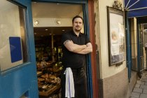 Fishmonger standing outside of store, selective focus — Stock Photo