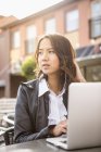 Young woman using laptop in Solvesborg, Sweden — Stock Photo