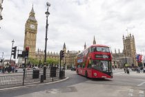 Double Decker bus by Big Ben in London, England — Stock Photo