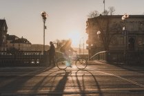 Man bicycling at sunset in Stockholm, Sweden — Stock Photo