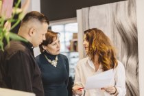 Hairdressers discussing business, selective focus — Stock Photo