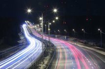 Light trails on highway at night in Helsinki, Finland — Stock Photo