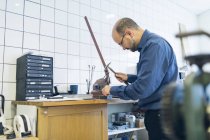 Goldsmith working with hammer at workshop, selective focus — Stock Photo