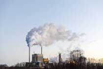 Factory with smoke stacks, selective focus — Stock Photo