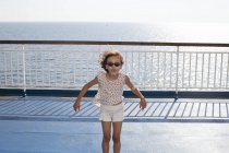 Girl with sunglasses by sea, selective focus — Stock Photo