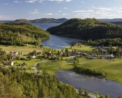 Town by forest and river in High Coast, Sweden — Stock Photo