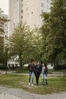 Teenage girls walking in park, selective focus — Stock Photo