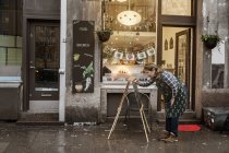 Cafe owner writing sign, selective focus — Stock Photo