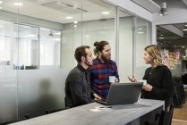 Coworkers with laptop, selective focus — Stock Photo