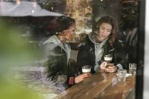 Teenage girls in cafe, selective focus — Stock Photo