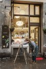 Cafe owner writing sign, selective focus — Stock Photo