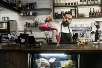 Mid adult man working in cafe, selective focus — Stock Photo