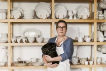 Portrait of woman holding vase, selective focus — Stock Photo