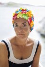 Portrait of mature woman wearing swimming cap — Stock Photo