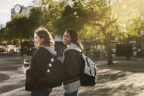 Teenage girls wearing backpacks, selective focus — Stock Photo