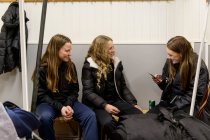 Girls in changing room prepaing for ice hockey training — Stock Photo