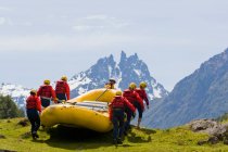 Rear view of people preparing for rafting, Chile                                   Model Releases — Stock Photo