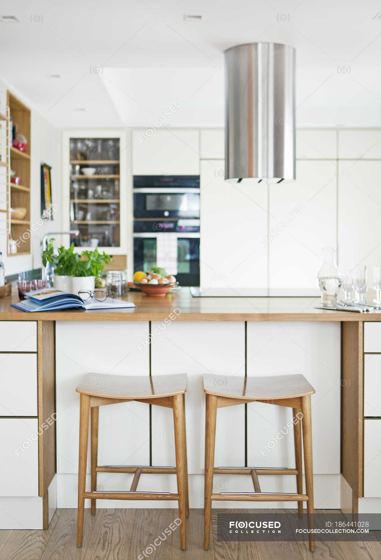 Front view of kitchen with wooden furniture — Focus On Foreground