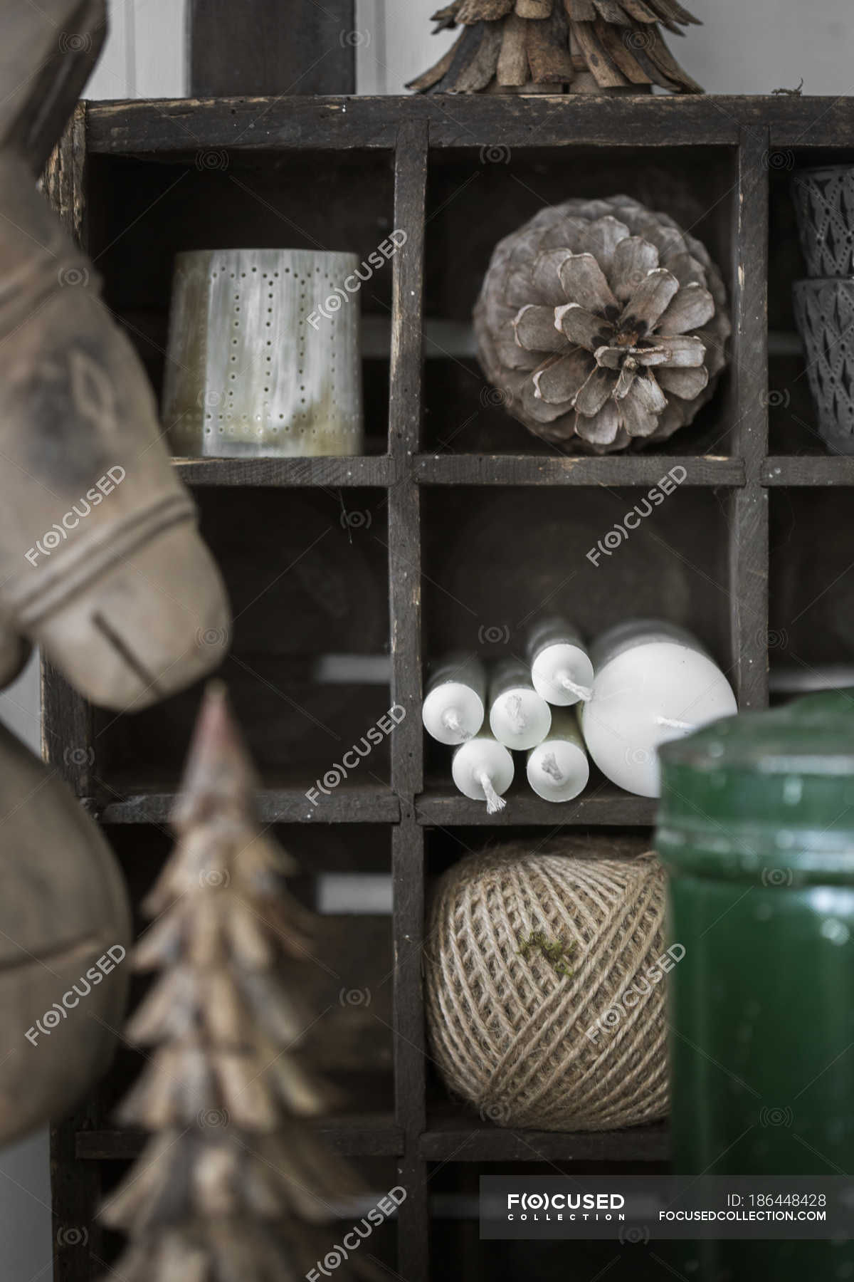 Winter Decorations And Candles On Wooden Shelves Selective Focus