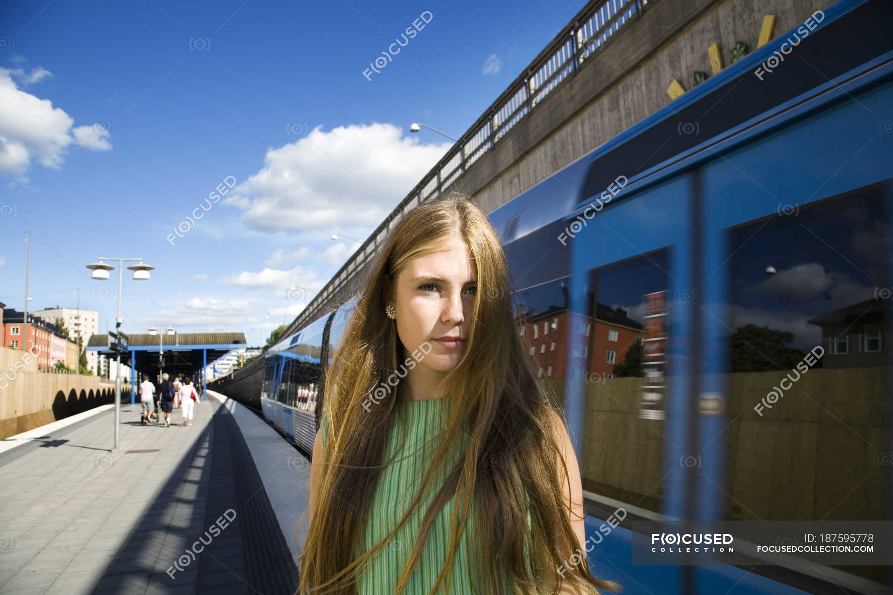 Portrait of teenage girl on railroad station platform — dress, Front ...