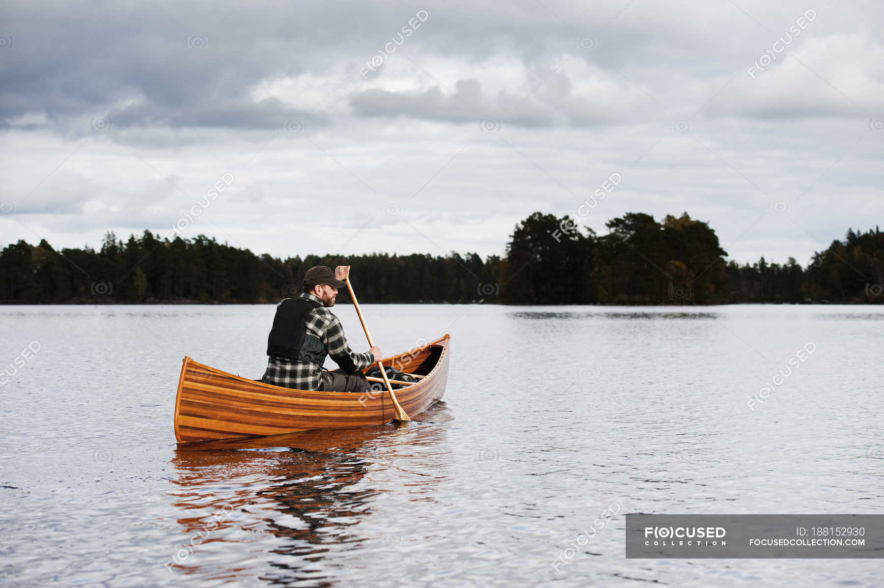 Man Paddling Canoe On Lake At Autumn Horizontal European Stock   Focused 188152930 Stock Photo Man Paddling Canoe Lake Autumn 