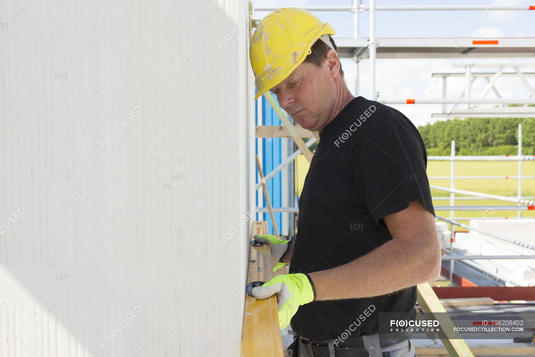 Construction Worker Using Spirit Level Building Site Industry Stock Photo