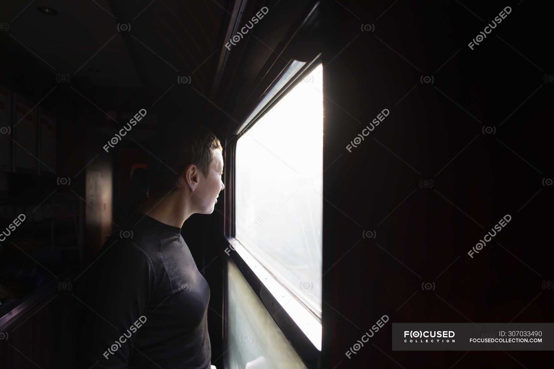 Woman looking out of train window, selective focus — female ...