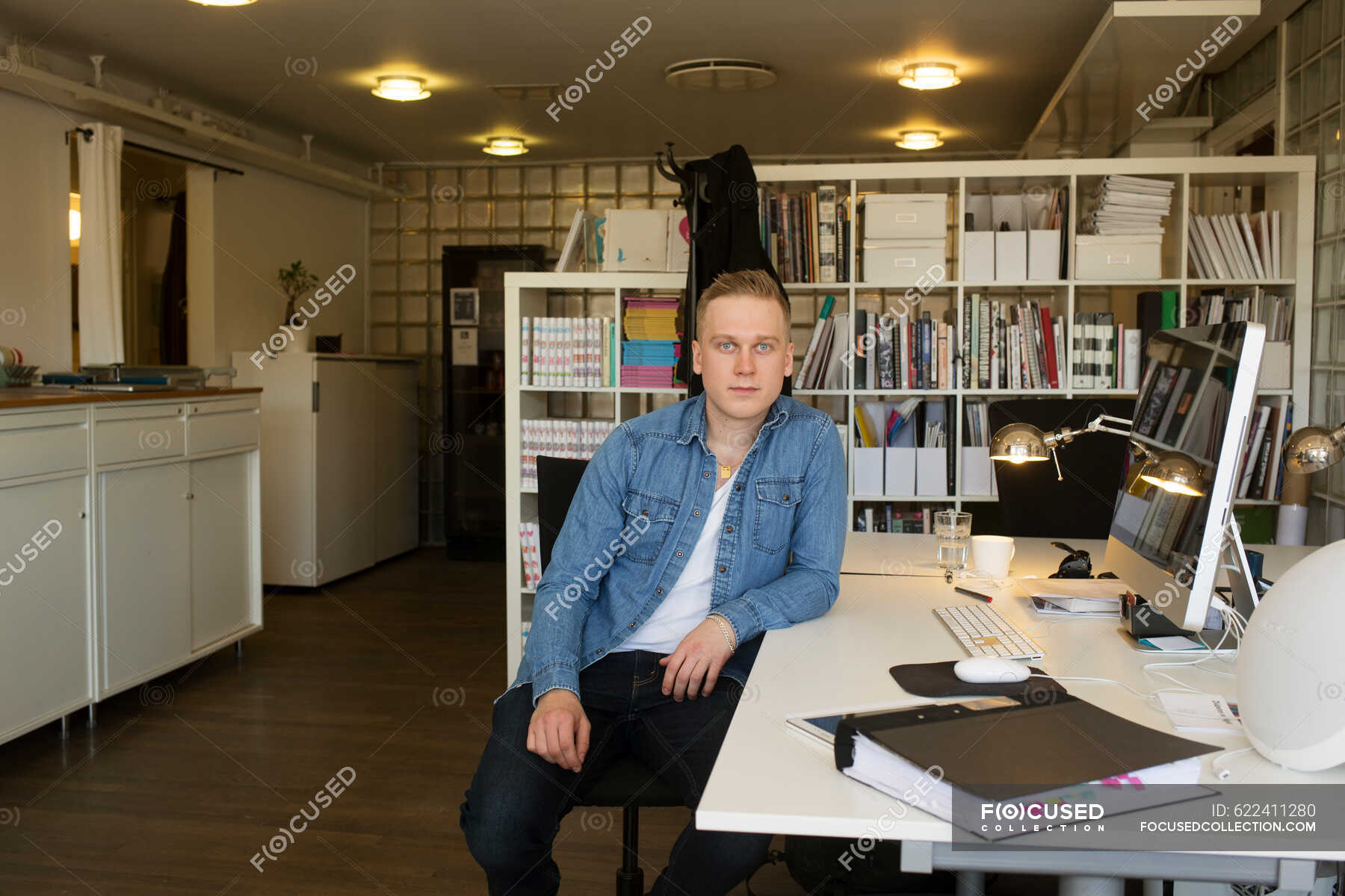 Young Man Sitting At Desk In Office Daytime Businesspeople Stock   Focused 622411280 Stock Photo Young Man Sitting Desk Office 