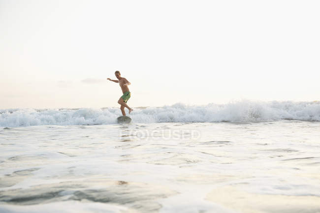 Teenage surfer on wave at Costa Rica — Stock Photo